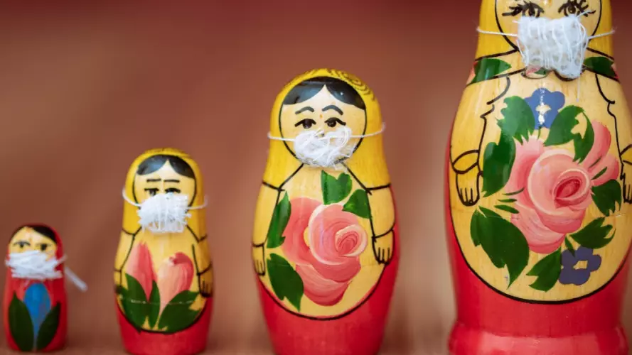Four dolls in masks